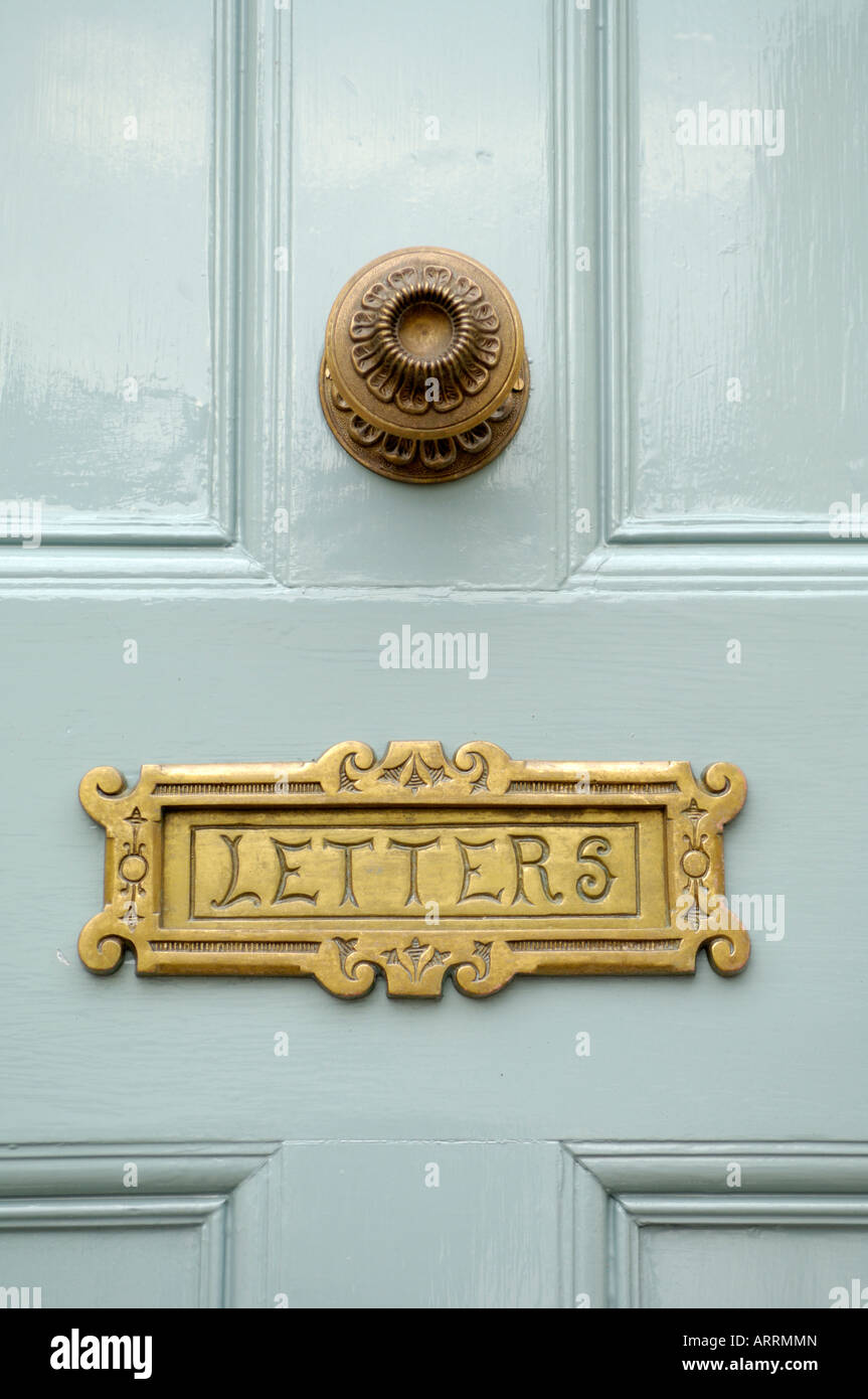 Letterbox and door handle in wooden door Stock Photo Alamy