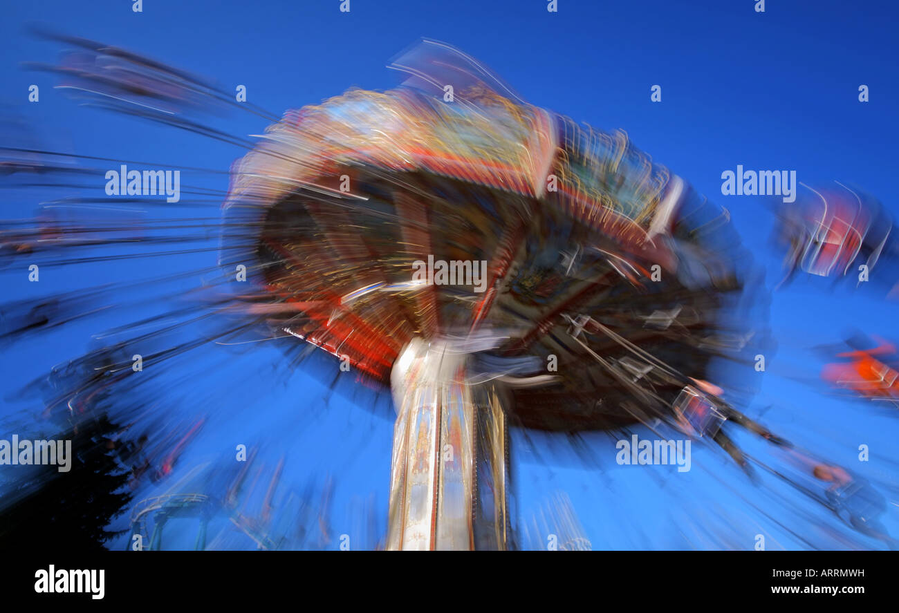 Tilting carousel rotating at speed with blurred riders at Divo ostrov ...