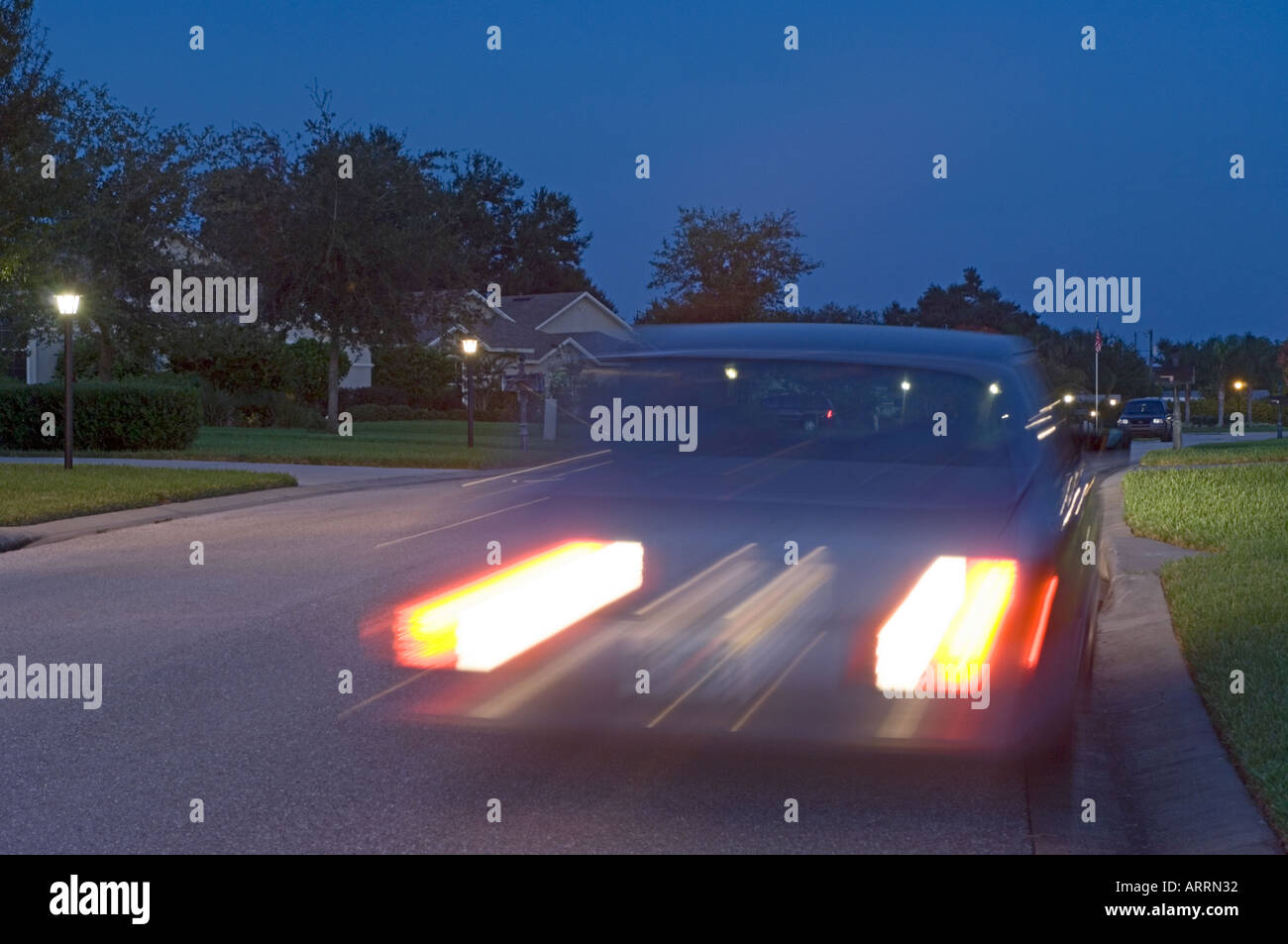 car drag racing in upscale residential area at night Stock Photo Alamy