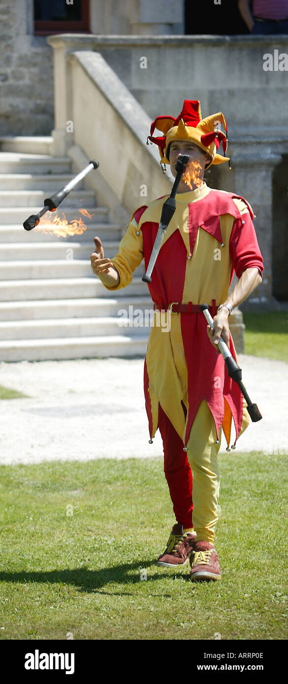 A juggler with fire sticks. Stock Photo
