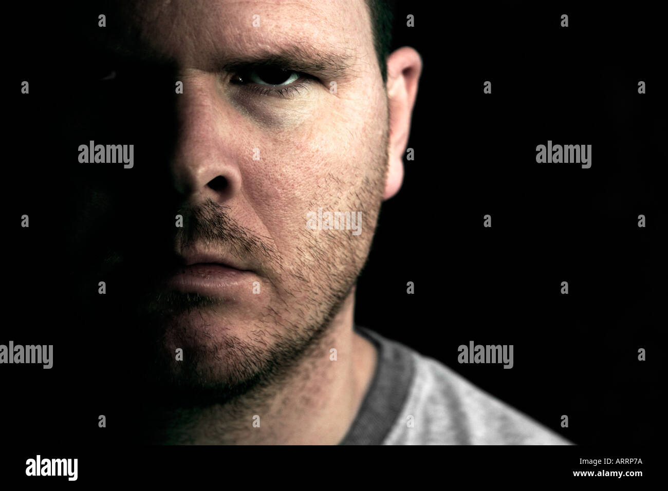 A man gives an intimidating stare. Stock Photo