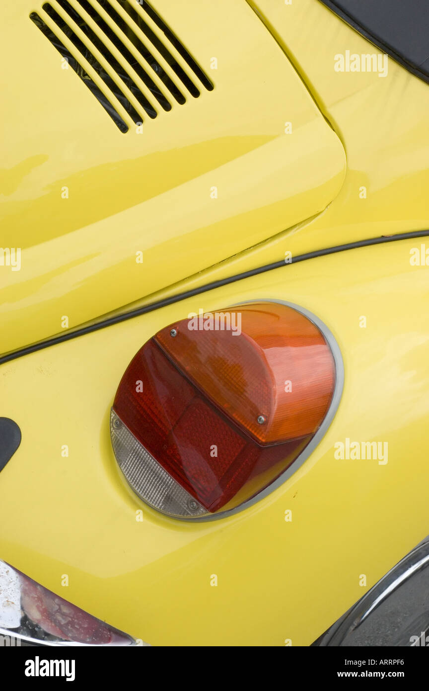Detail of tail light and rear of yellow volkswagen beetle Stock Photo