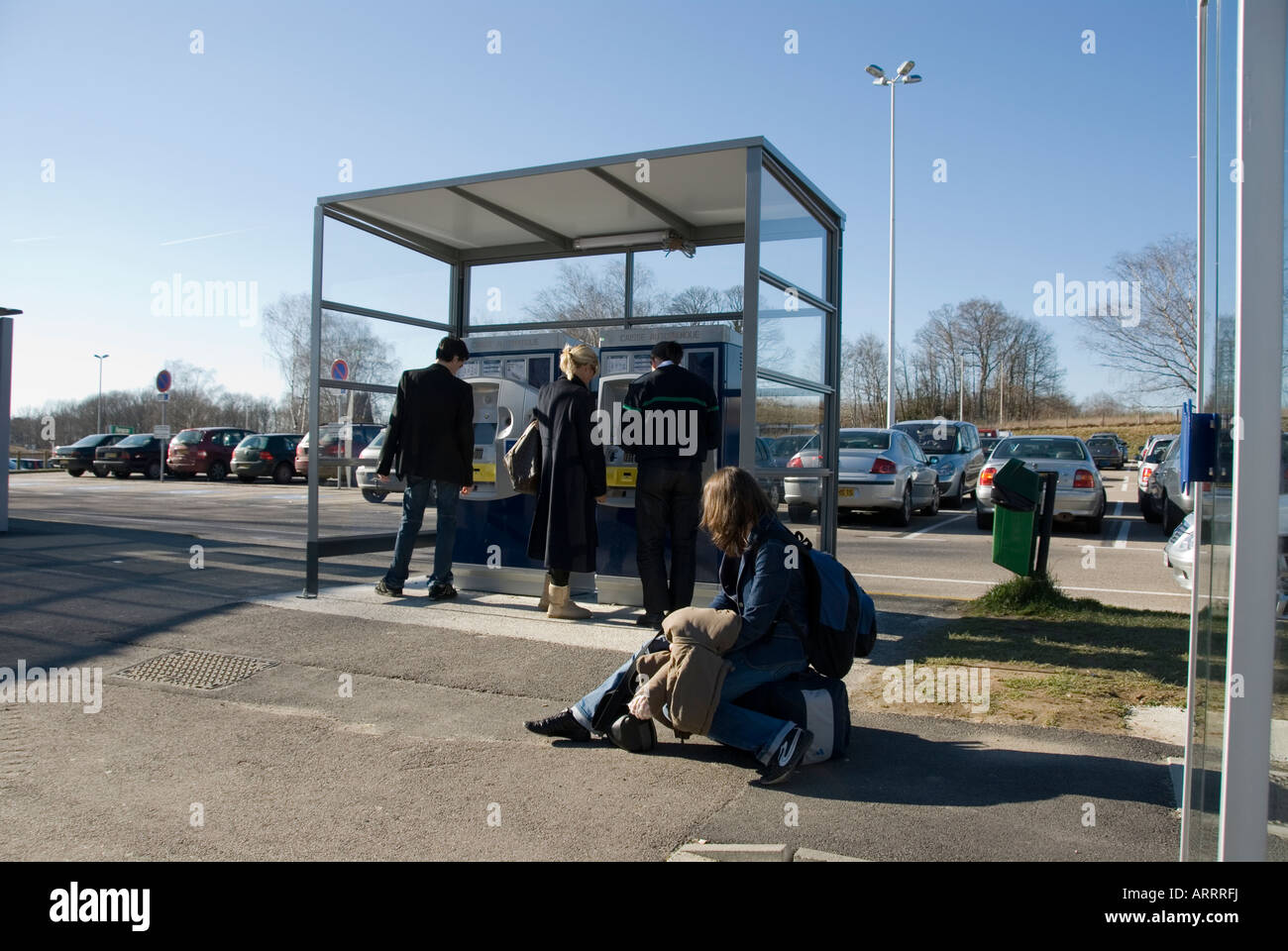 People queueing to pay for their car park tickets at an automated ...
