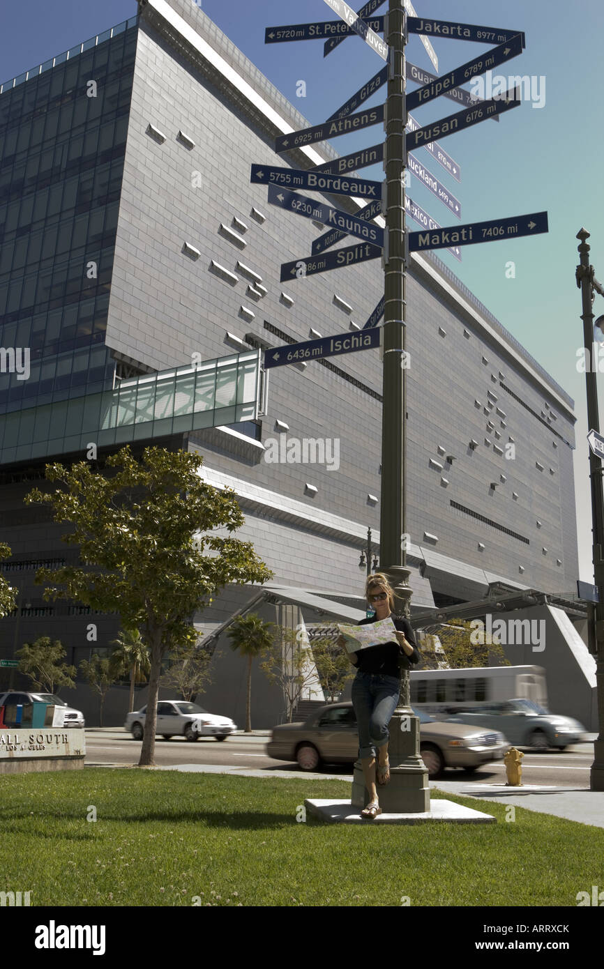 Woman leaning against sign hi-res stock photography and images - Alamy