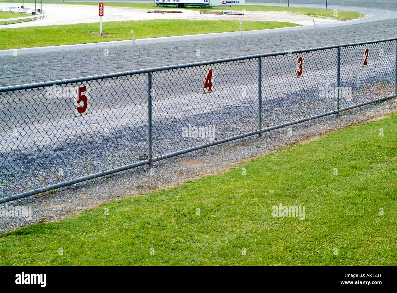 race track fence with numbers Stock Photo Alamy