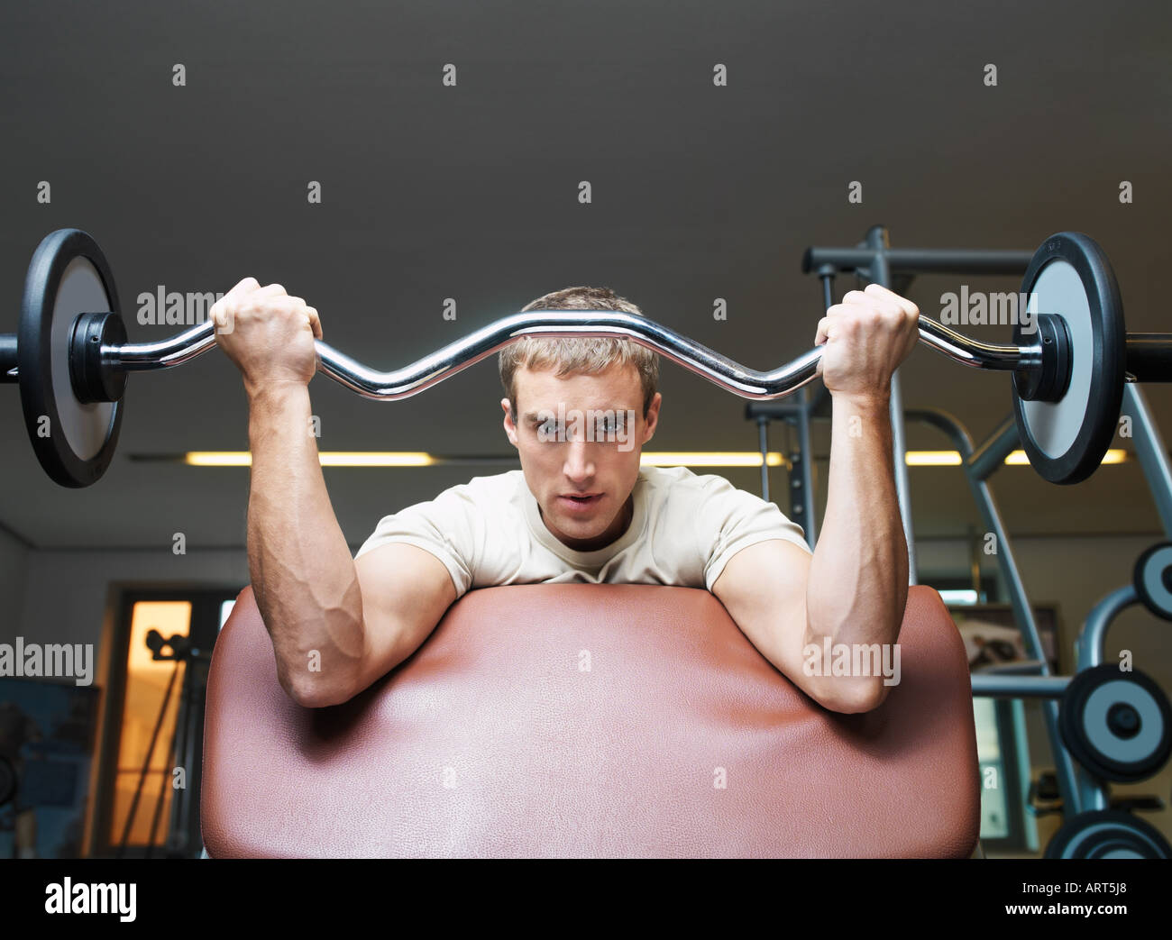 Man weight training Stock Photo - Alamy