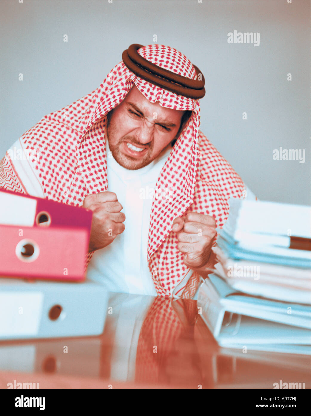 Arab businessman being angry at his desk Stock Photo - Alamy