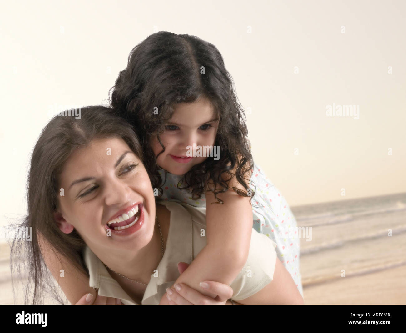 Mother and daughter having fun on the beach in Dubai Stock Photo Alamy