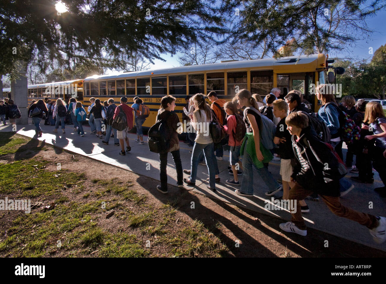 California middle school students walk to buses Stock Photo
