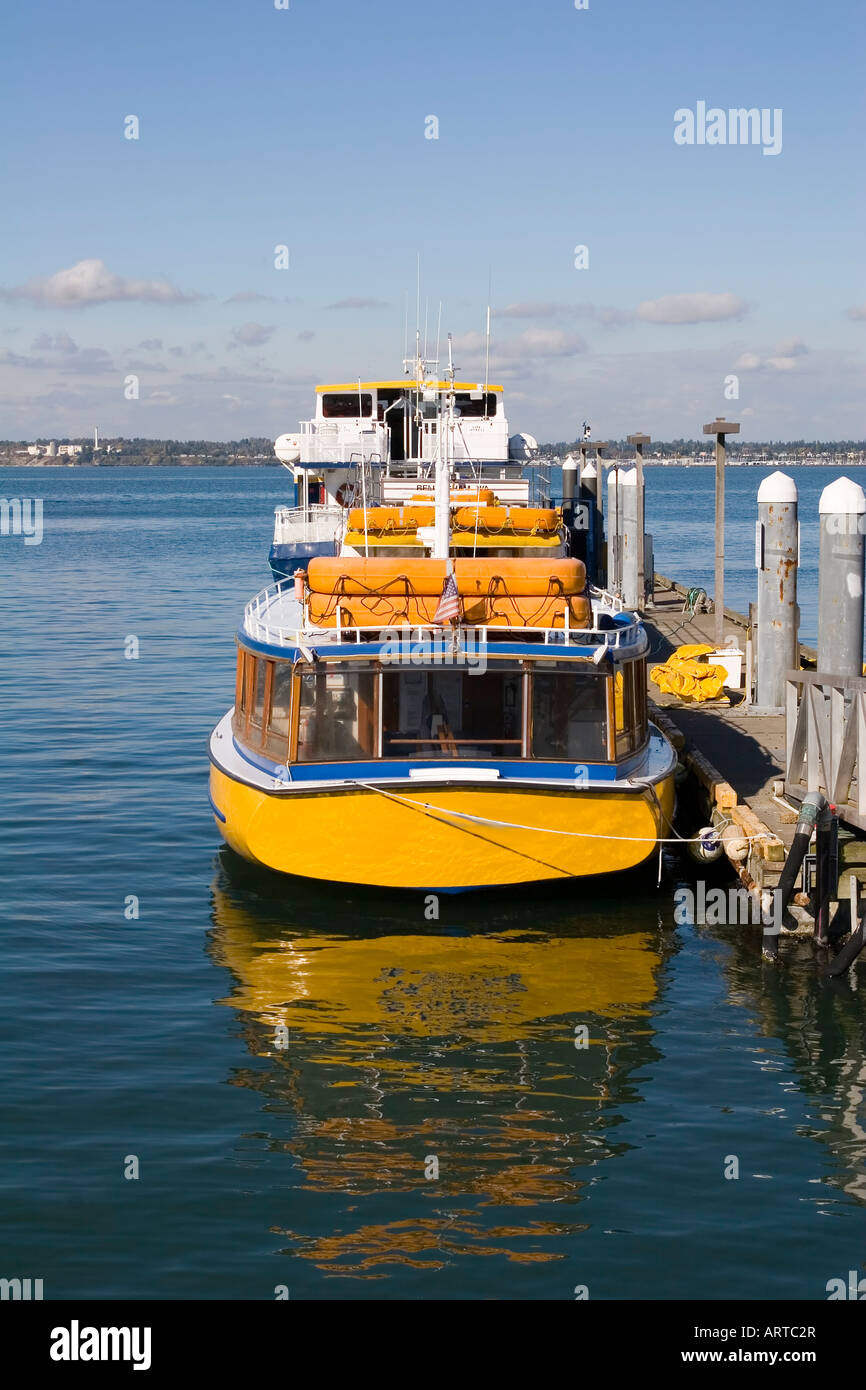 A bright yellow ferry boat waiting at the dock Stock Photo Alamy