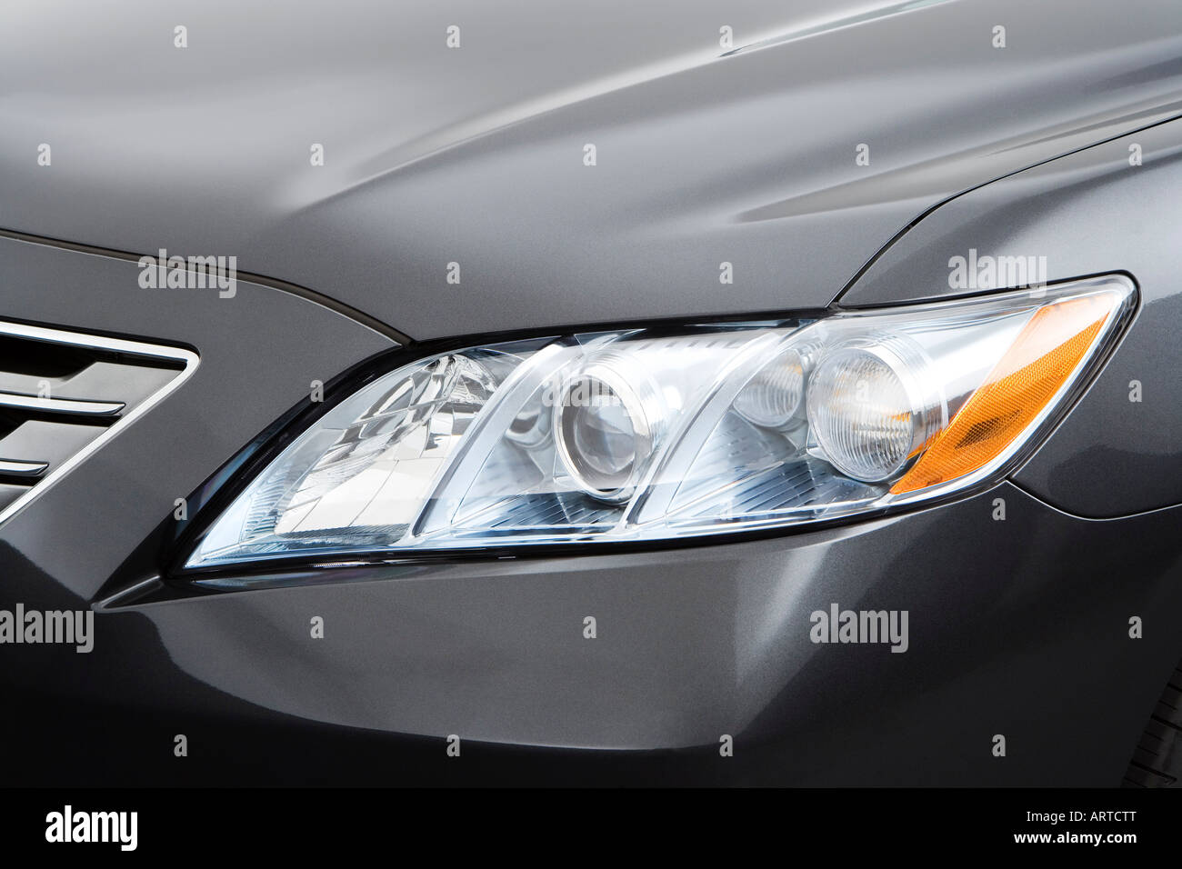 2008 Toyota Camry Hybrid in Gray - Headlight Stock Photo
