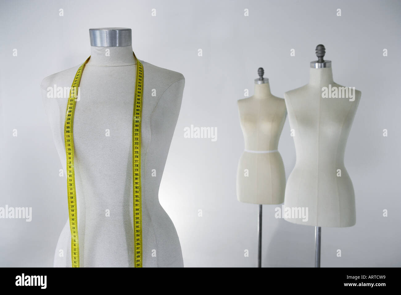 Tailors dummy with tape measure Stock Photo Alamy