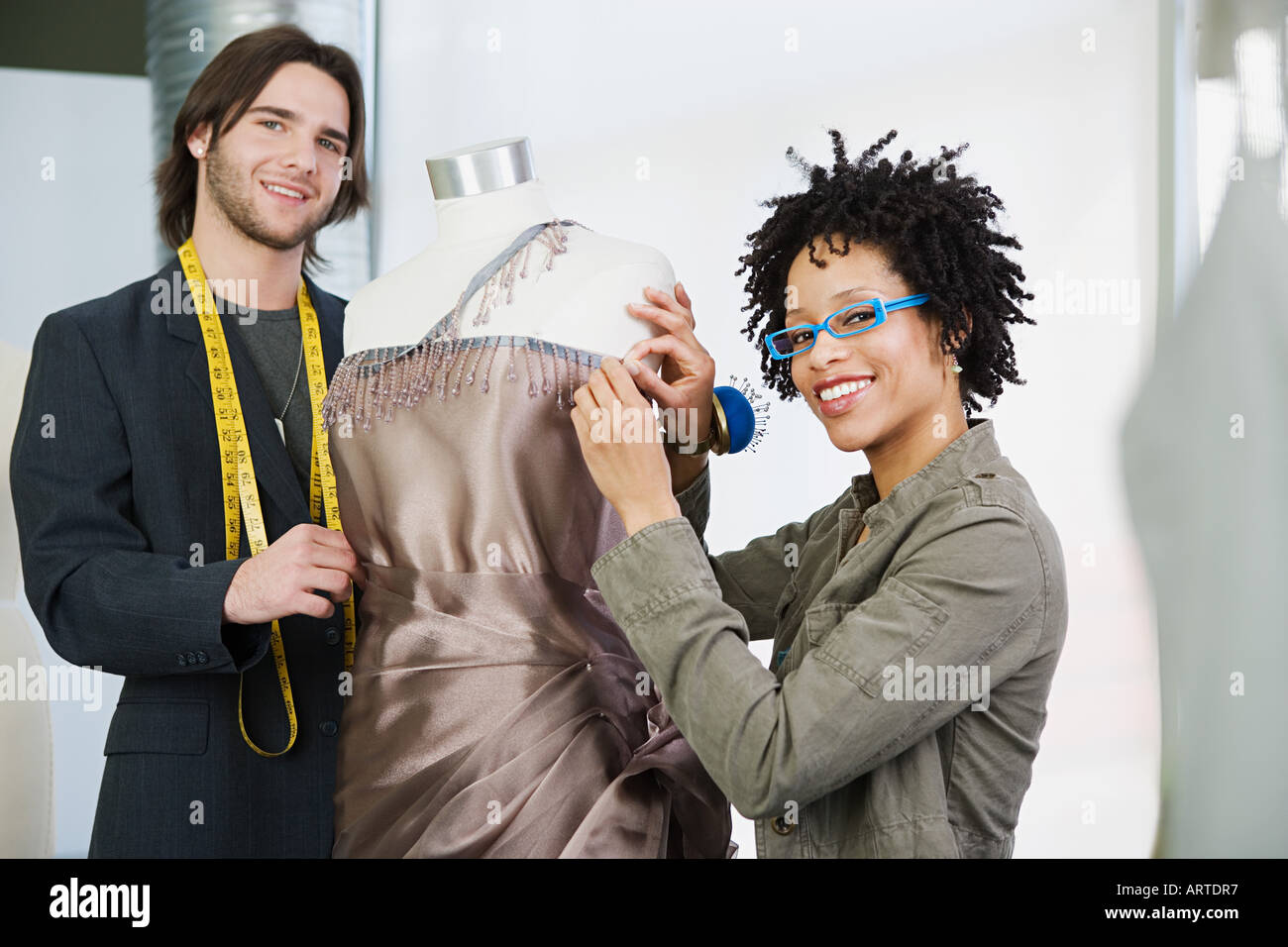 Tailors working on dress Stock Photo