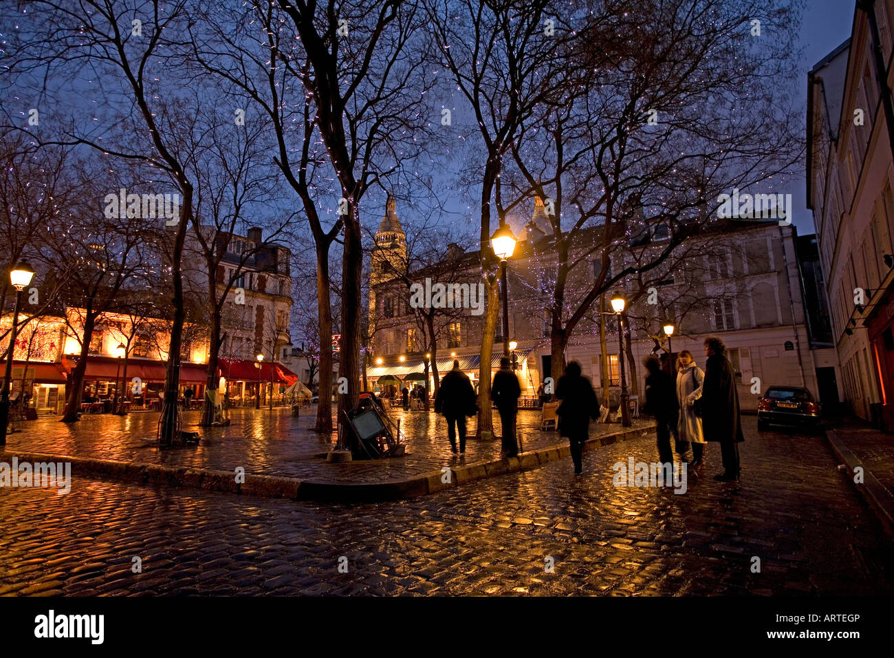 Night in the Place du Tertre and Sacre Coeur Chruch in Montmartre Paris France Stock Photo
