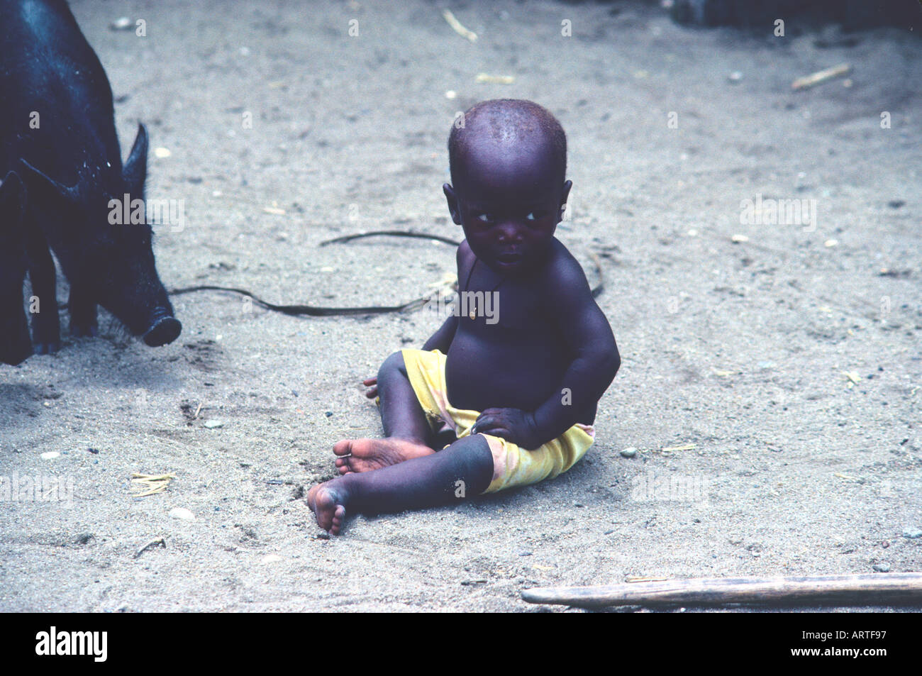 A small Tofinu child with a livestock Ein kleines Tofinu Kind mit Vieh  Stock Photo