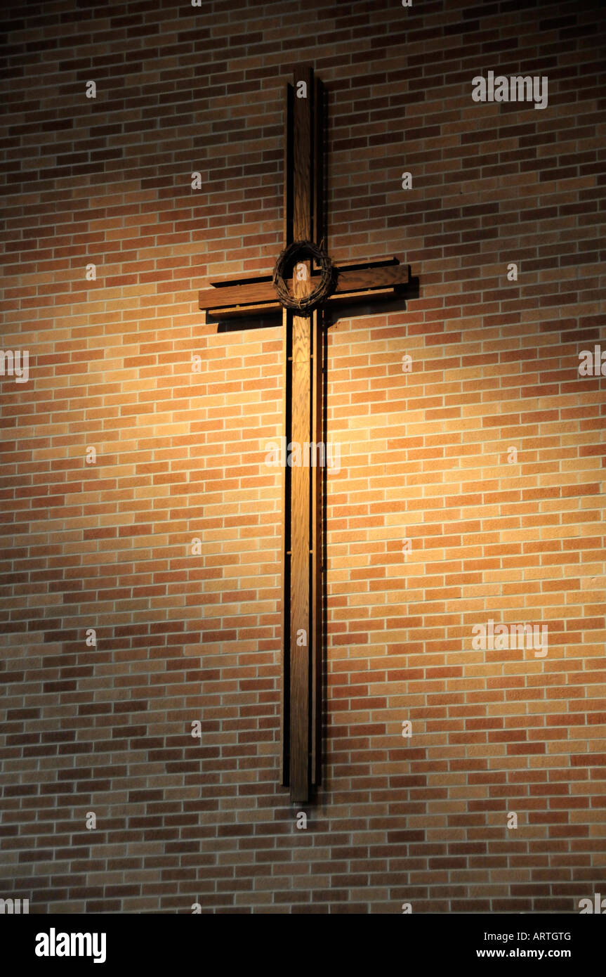 Religious cross on interior church wall Stock Photo - Alamy