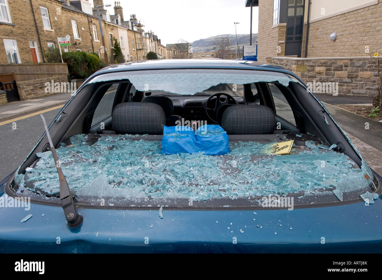 Broken Car window, in residential street, West Yorkshire, Northern
