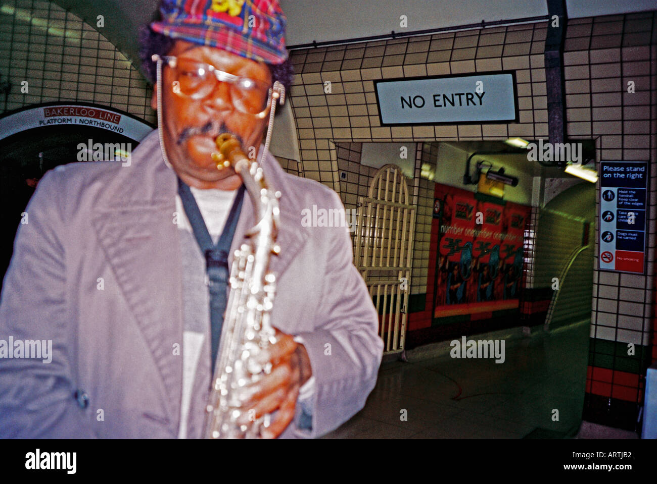 Saxophone busker on the London underground Stock Photo Alamy