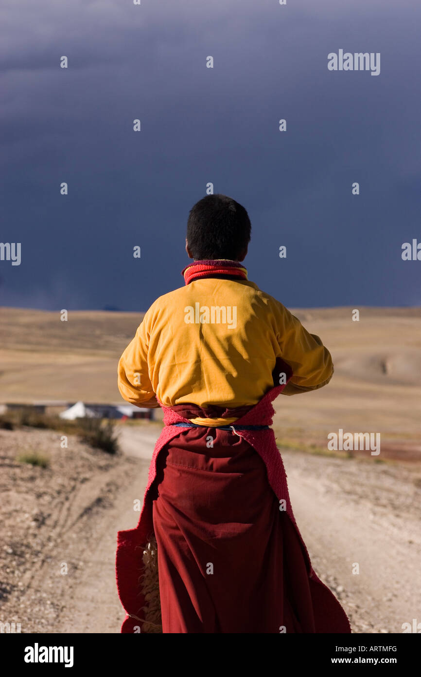 Pilgrim prostrating around holy Lake Mansarovar, Western Tibet. Stock Photo