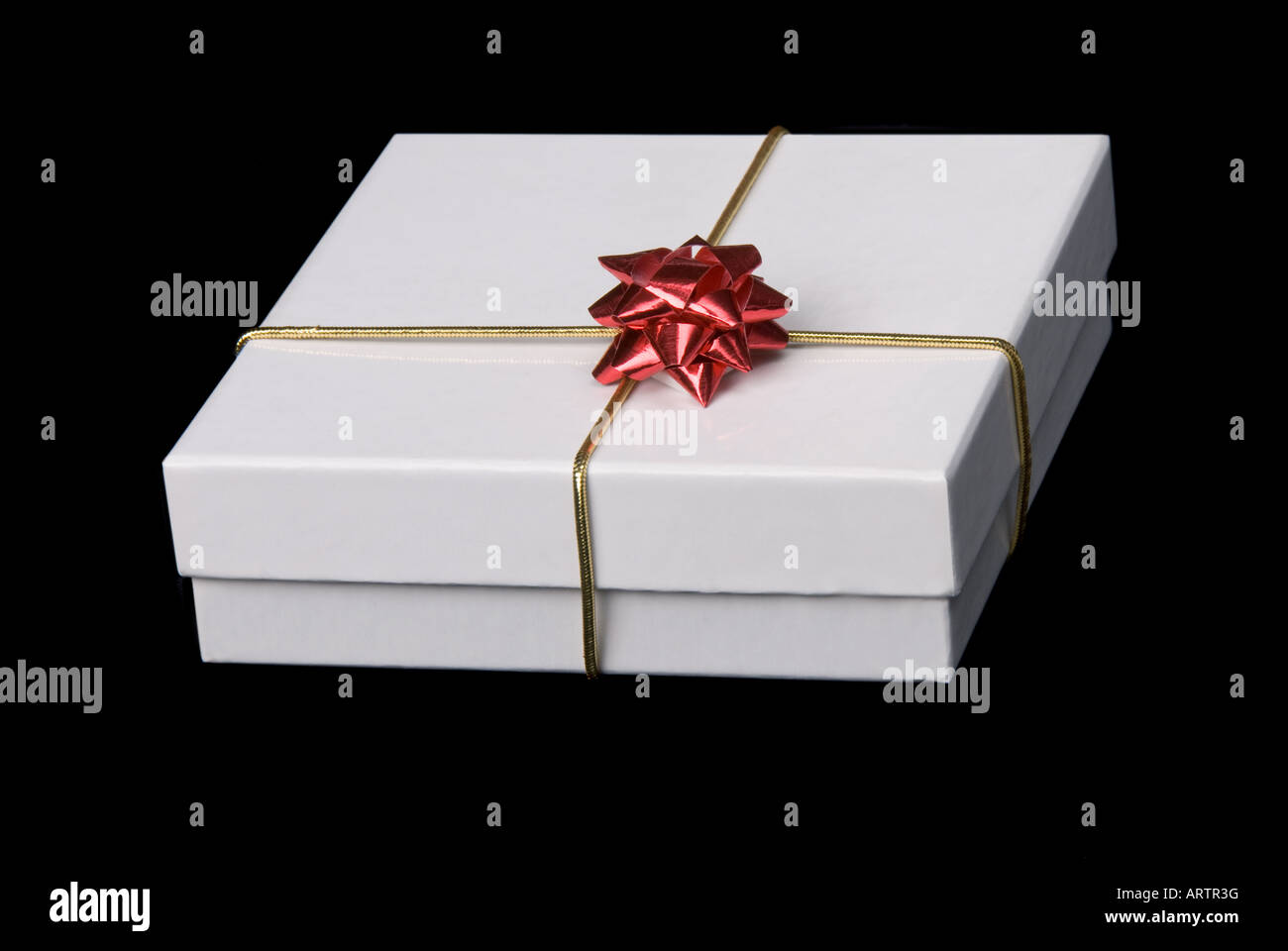 A beautiful gift box isolated against a black background Stock Photo ...