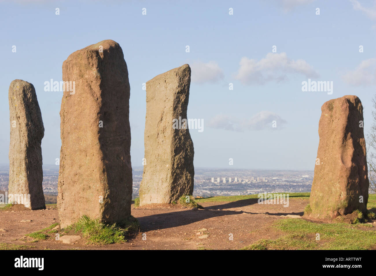 The Four Stones Clent Hills with the towerblocks of Brierley Hill Dudley in the distance. Stock Photo