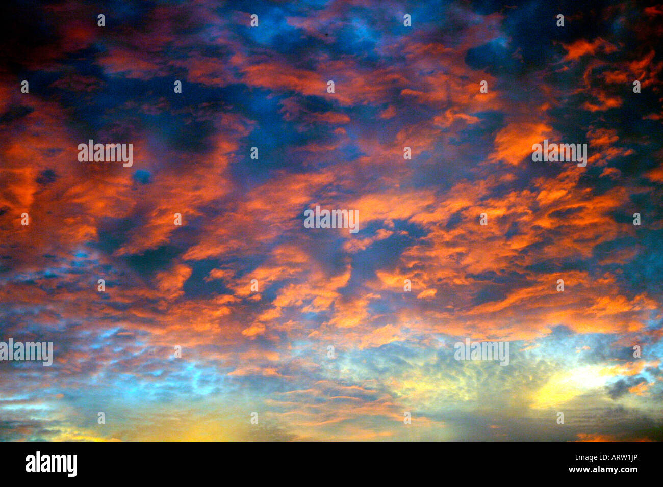 Skyscape by nature - colourful stunning late evening sky with clouds of different colours, hues, shades and tints Stock Photo