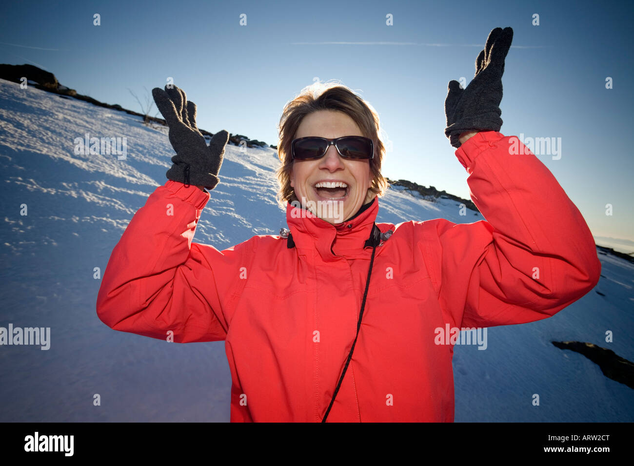 Enthusiastic young Lady going on a skiing holiday (France). Enthousiaste jeune femme à la neige (France). Stock Photo