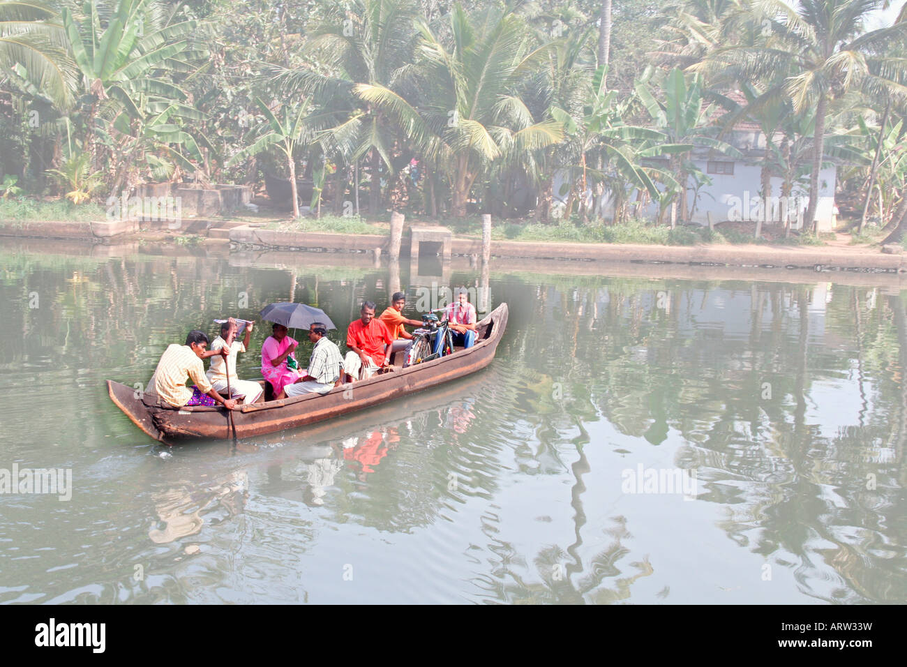Water taxi in Kerala, a small boat ferrying local people in Alappuzha district, traditional means of transport in backwaters Stock Photo