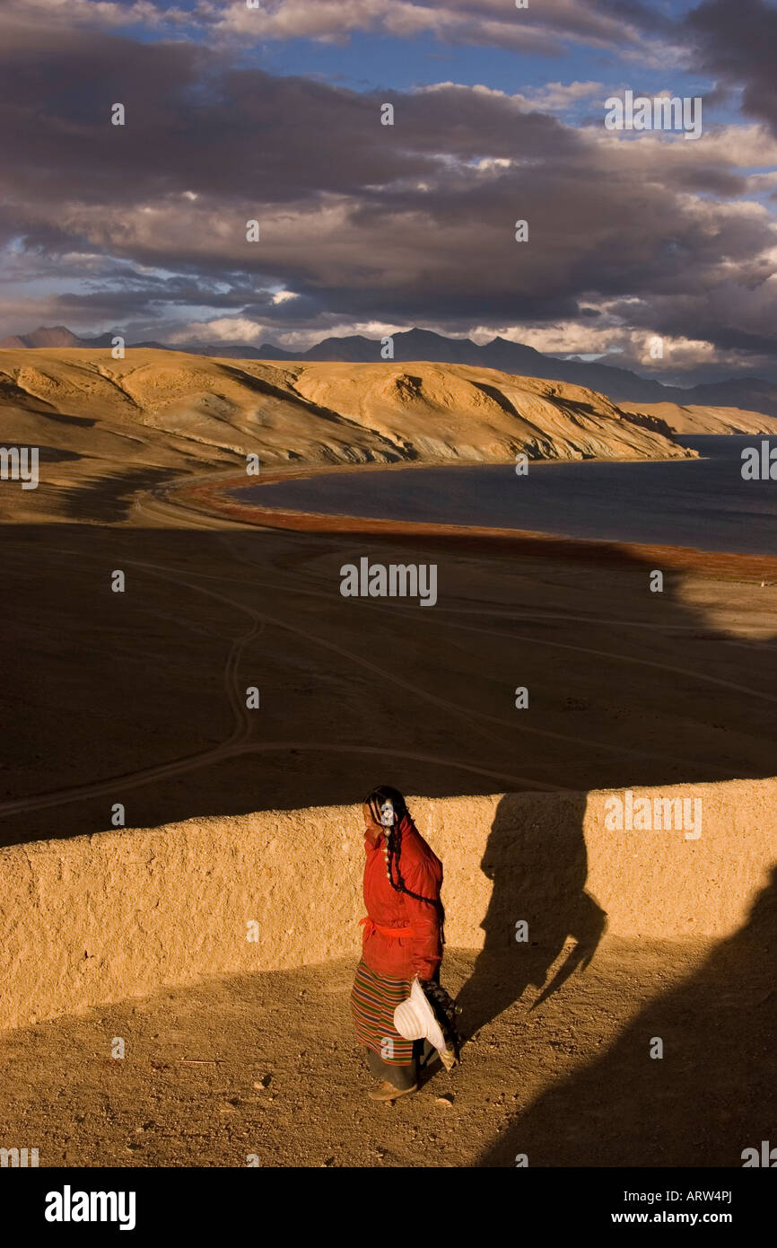 Pilgrim at sunset, Lake Mansarovar, Western Tibet. Stock Photo