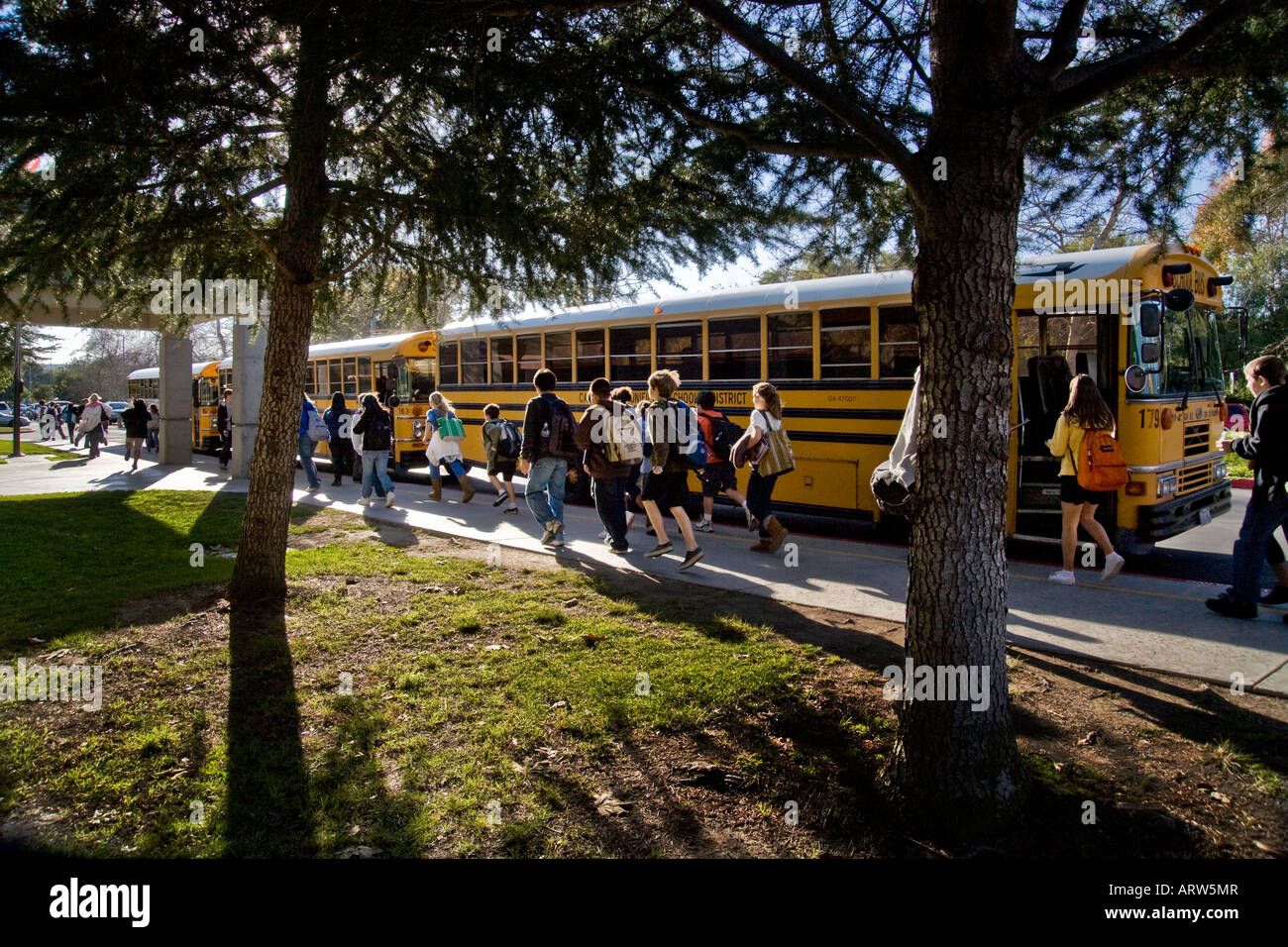 California middle school students walk to buses Stock Photo