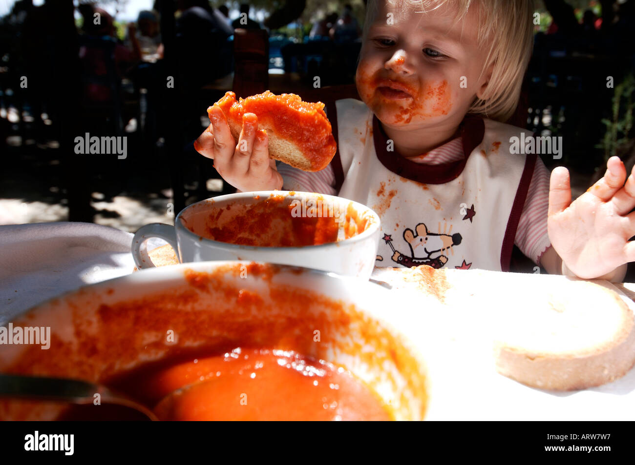 Crete girl eating tomato soup Stock Photo