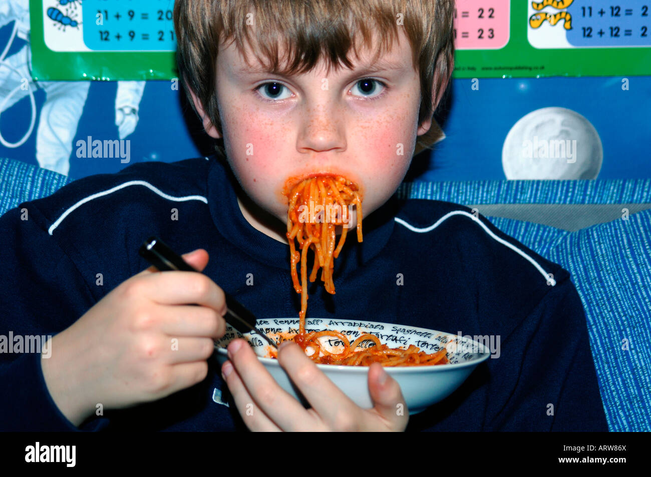 A 13yr Old Boy Eating Spaghetti. Stock Photo