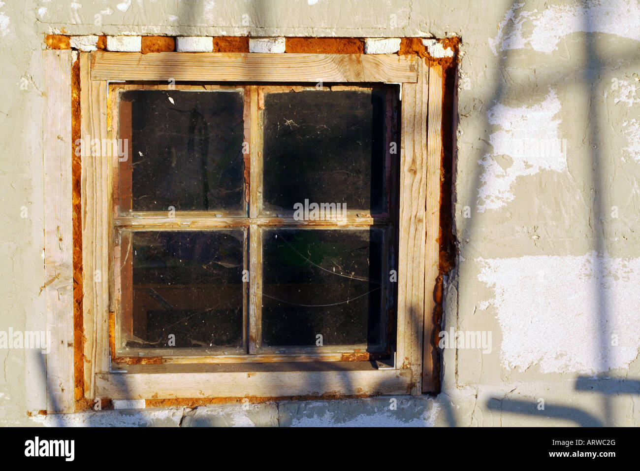 Unfinished old window with frame. Stock Photo