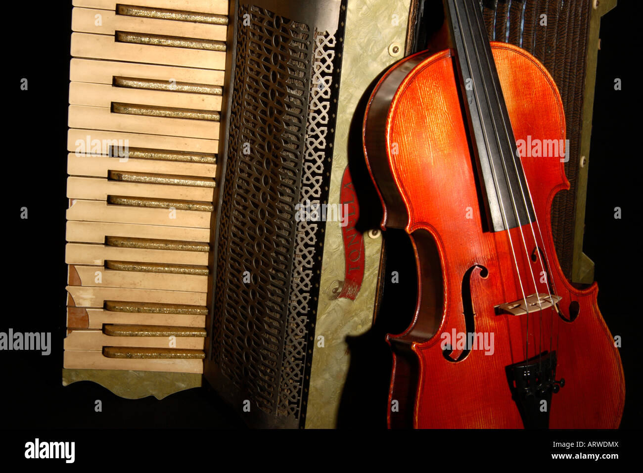 An old Accordion and Violin semi-abstract. Stock Photo