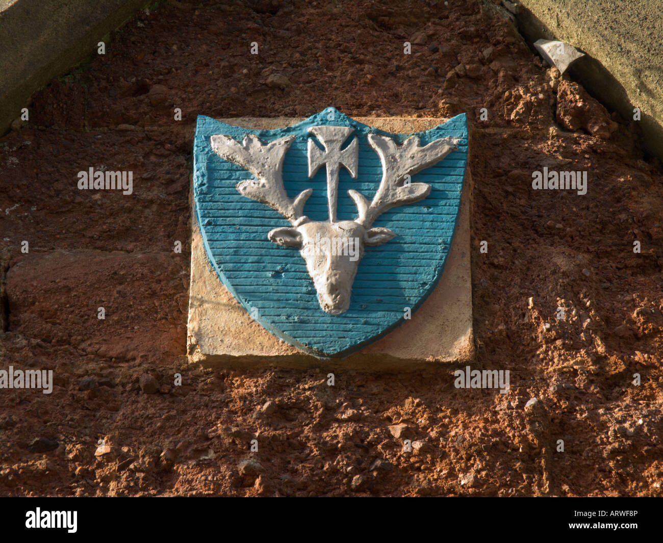 Stag's head crest on a building in Cathedral Yard, Exeter, Devon Stock