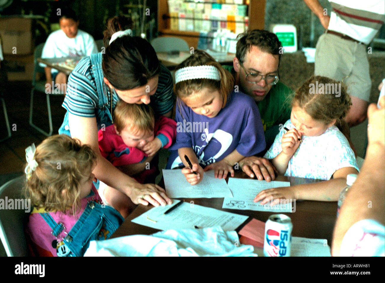 Family completing safety test at Bicycle Safety Rodeo. St Paul Minnesota USA Stock Photo