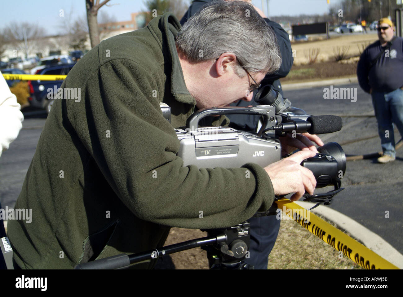 TV cameraman filming  incident , USA Stock Photo