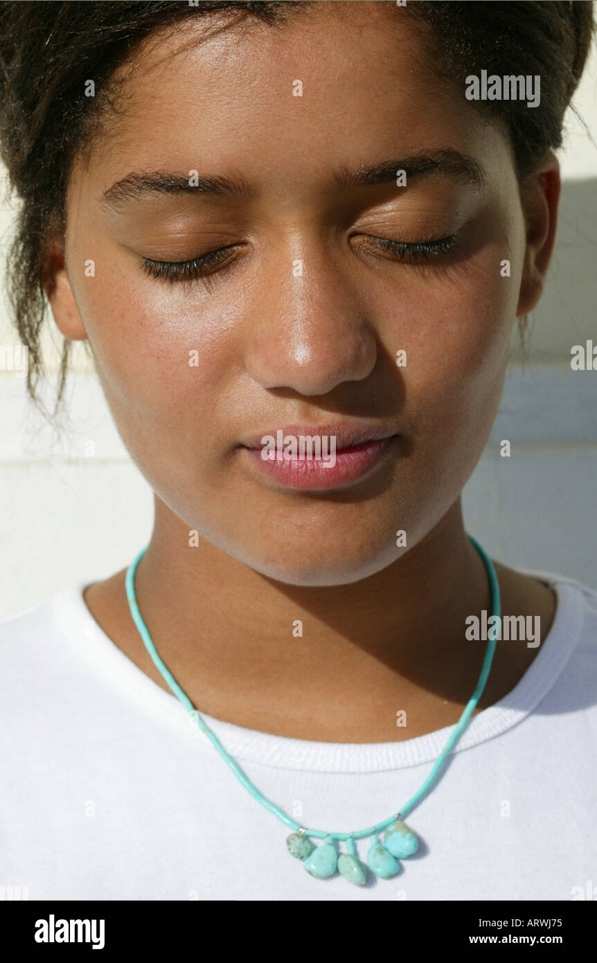Portrait of young Asian woman with her eyes close in the sun Stock ...