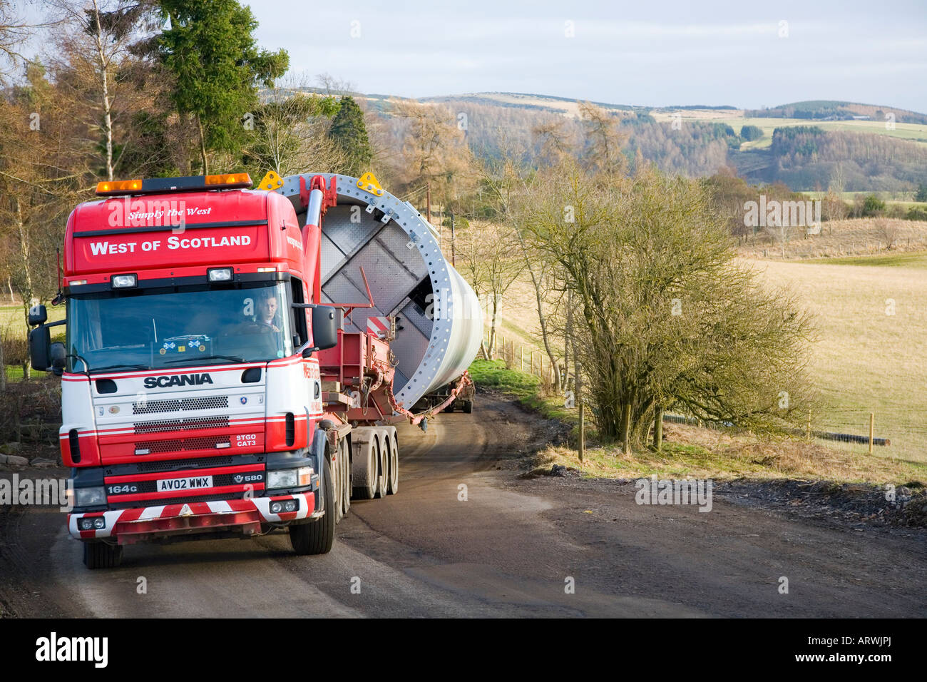 Give Sværgods A/S Transport; Freight by road, Delivering taking wind turbine towers, windfarm components to Drumderg Site, Alyth, Scotland, Stock Photo