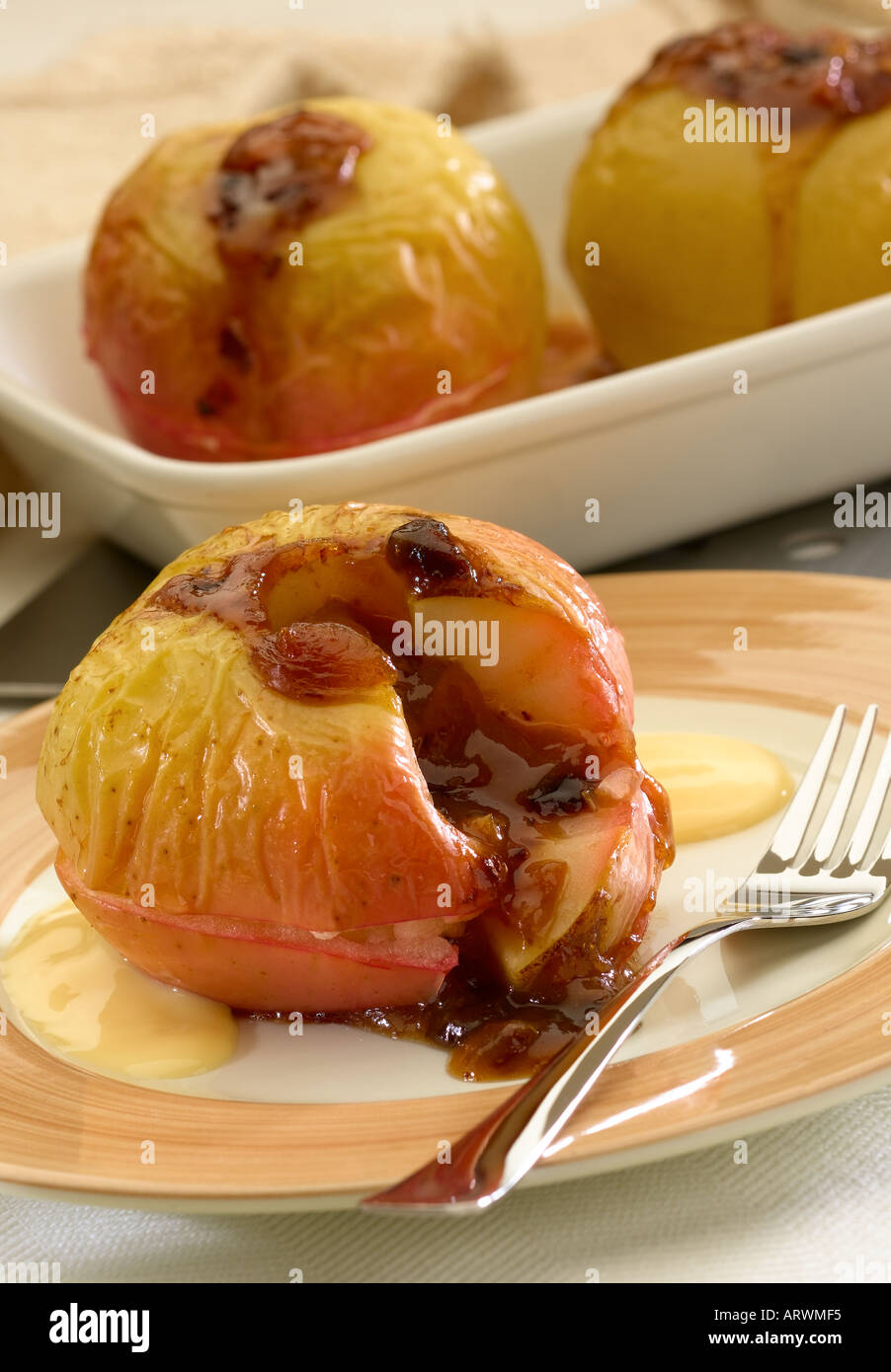 baked apples with custard Stock Photo Alamy
