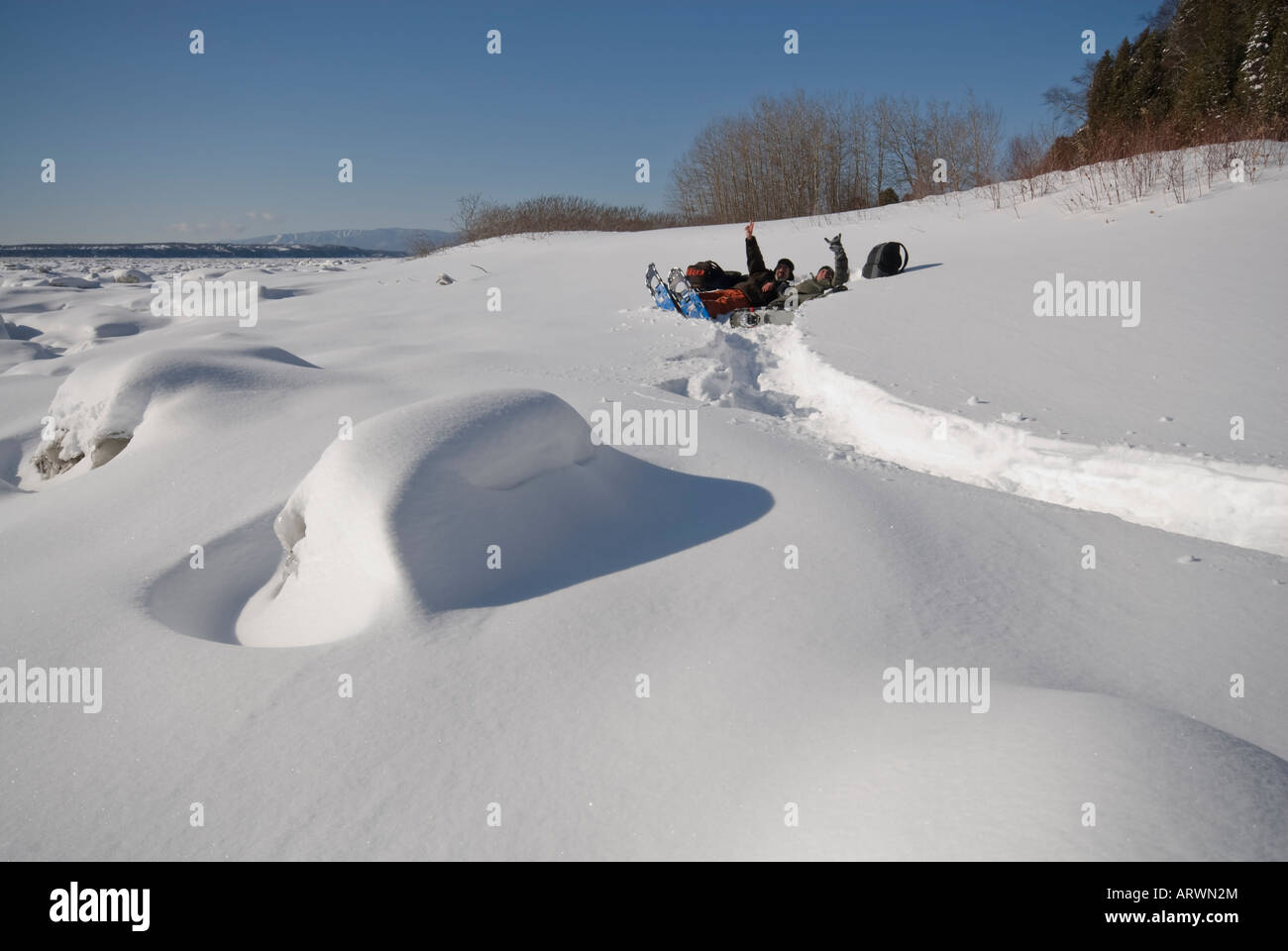 Peoples playing in deep snow with snowshoes Stock Photo Alamy