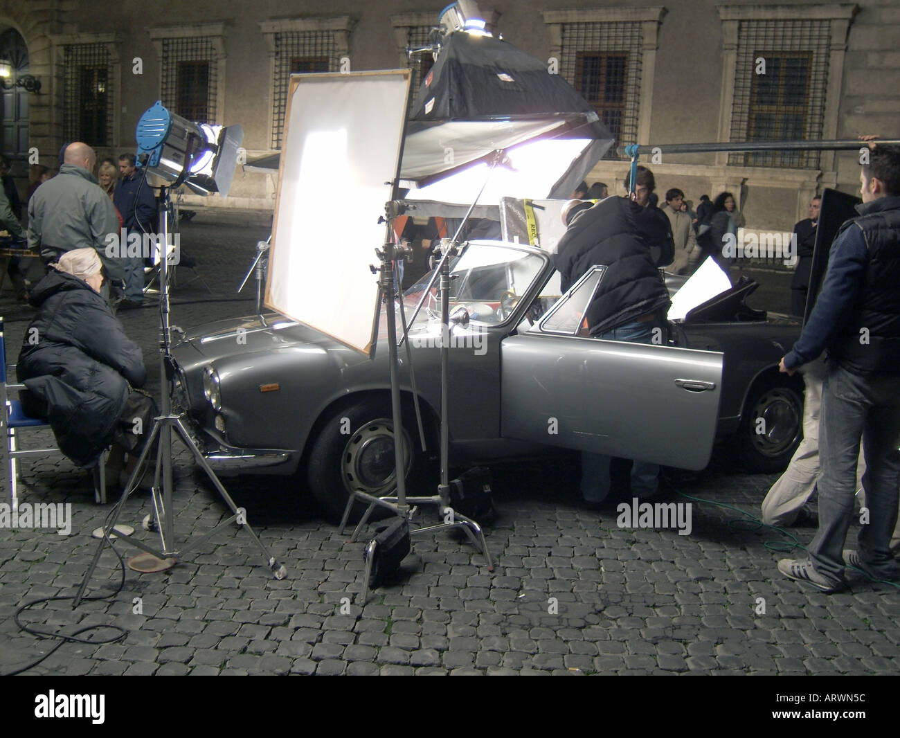 tv film crew filming scene at night in rome Stock Photo Alamy
