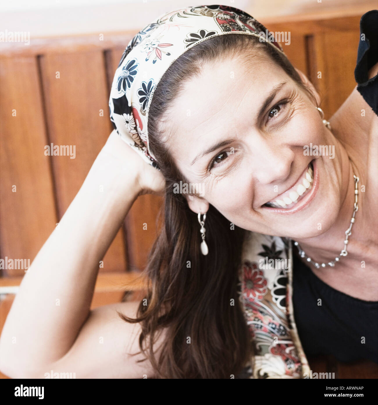 Portrait of a mid adult woman lying on a bench and smiling Stock Photo ...