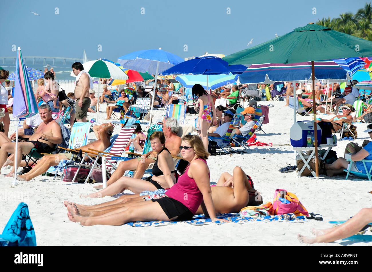 Visitors to Fort Myers Beach Florida enjoy sun and water Stock Photo