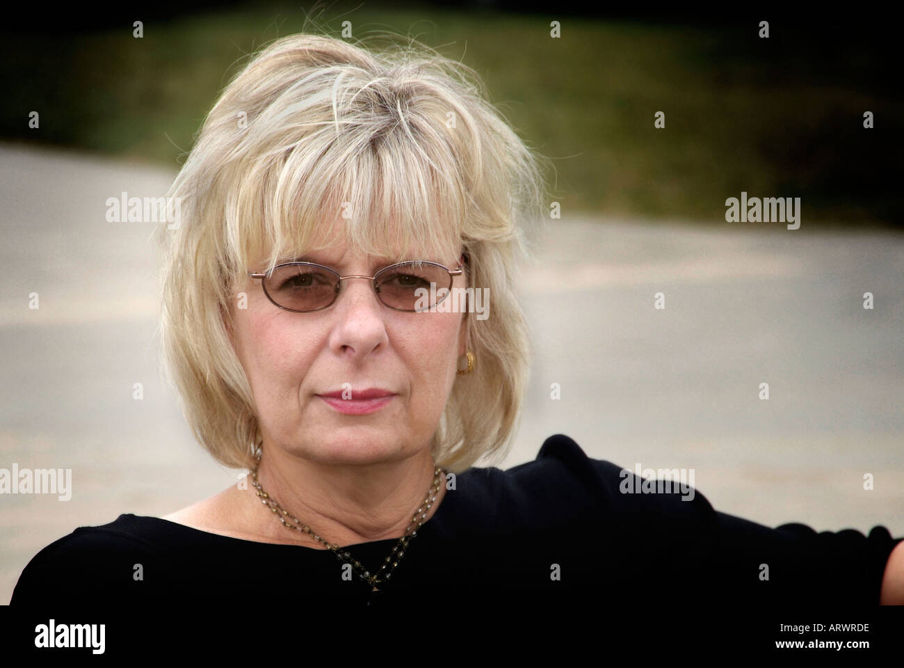 Portrait of a middle age female wearing sun glasses Stock Photo Alamy