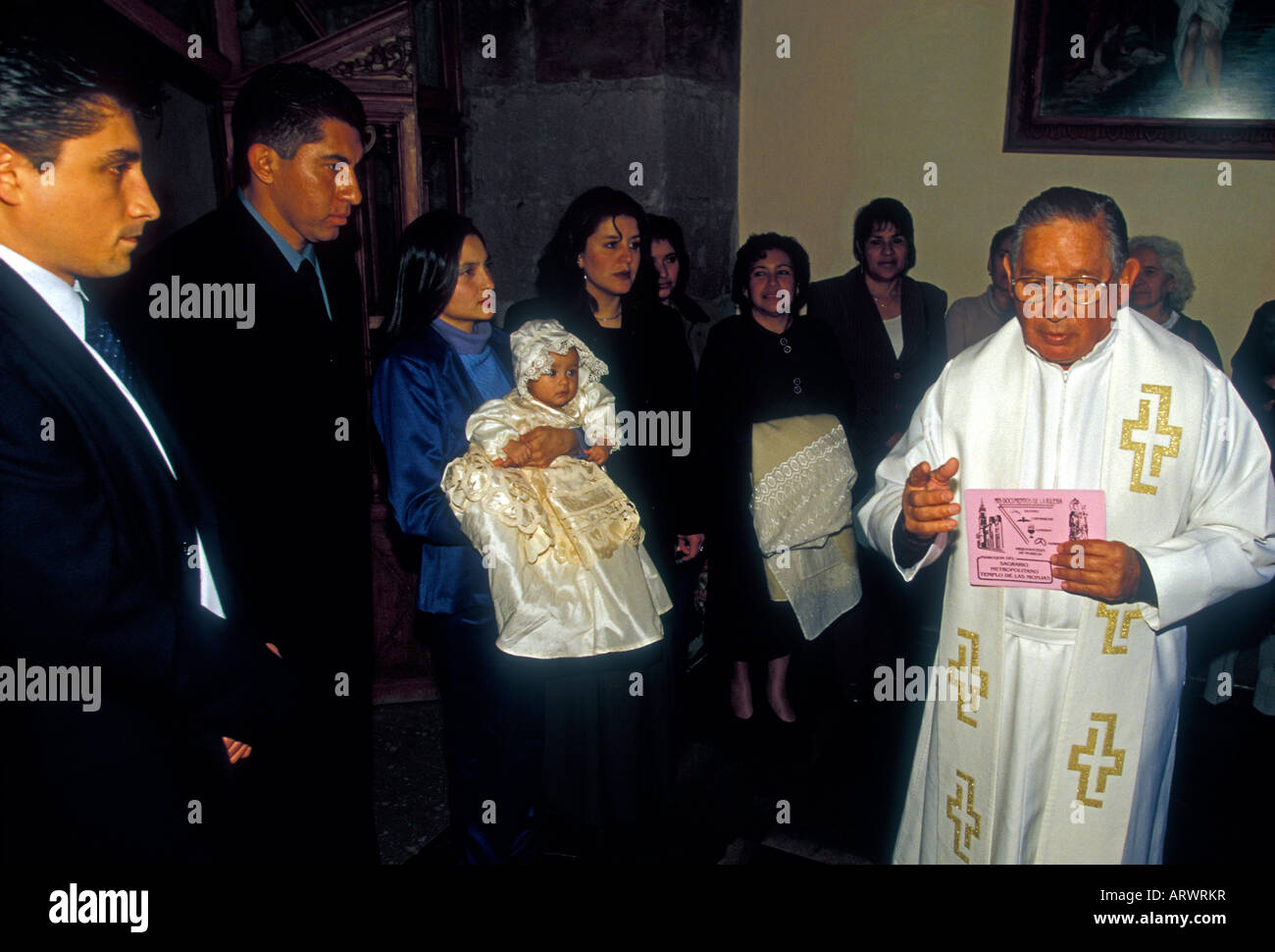 Mexican family, people, priest, padre, baptism, Cathedral of the Divine Savior, city of Morelia, Morelia, Michoacan State, Mexico Stock Photo