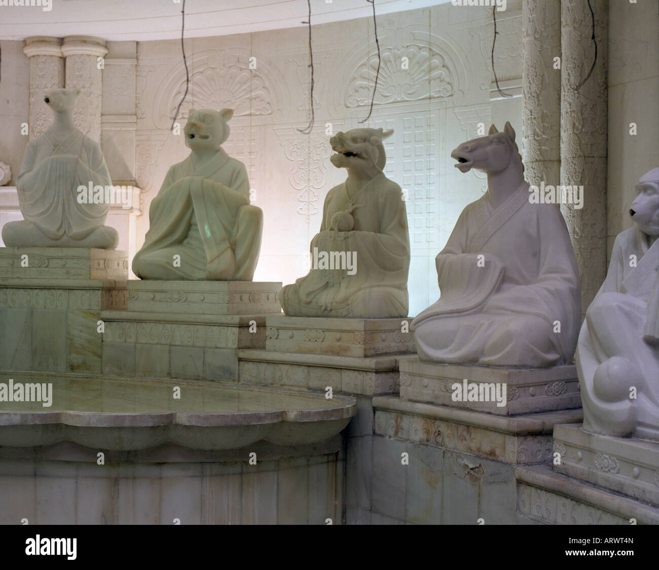 Figures from a Chinese zodiac fountain carved from marble in the Grand
