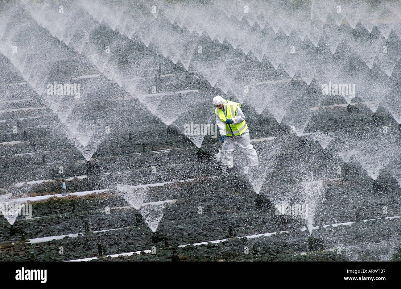 A sewage treatment operator carries out essential cleaning and Stock Photo: 5268662 - Alamy