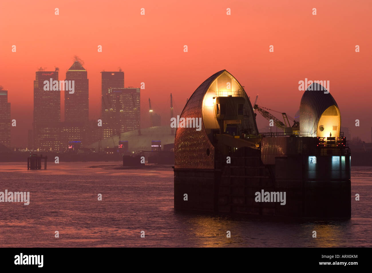 Thames Barrier - Canary Wharf & O2 in Background - London Stock Photo