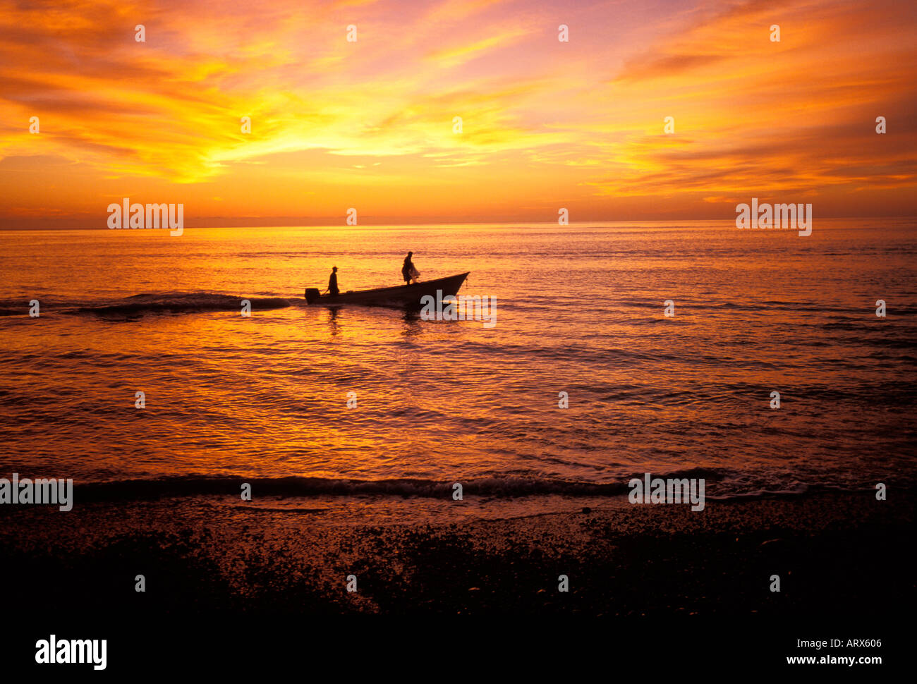 Fisherman heading out for a day of fishing at sunrise, Sea of Cortes, Cabo Pulmo, Mexico Stock Photo